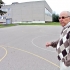 Директор 6-й средней школы А.Холстс показывает площадку для будущего футбольного поля